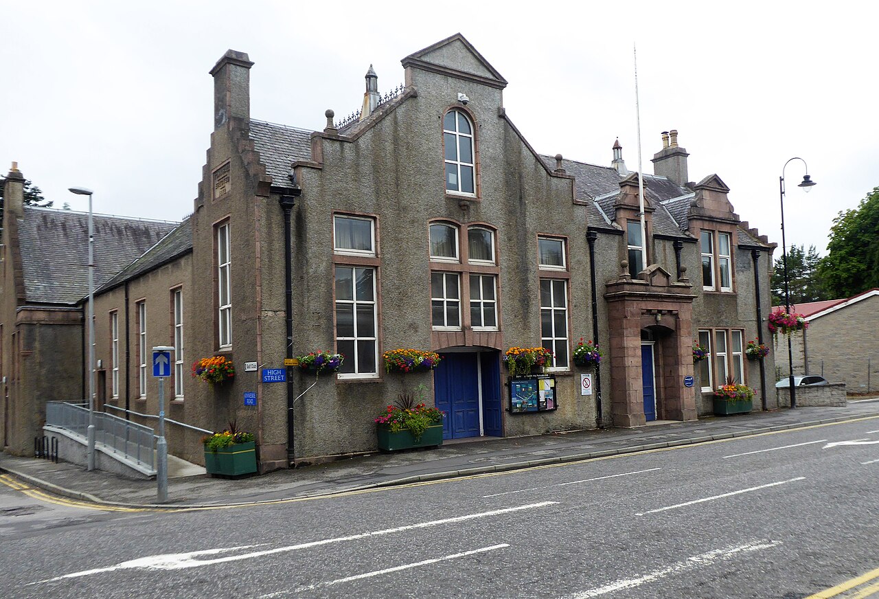 Stone facade of Banchory Town Hall beside the road