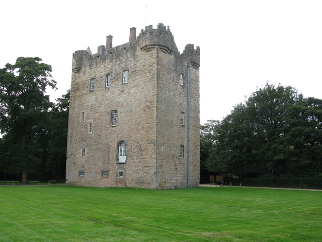 Stone tower house and green lawn at Alloa Tower