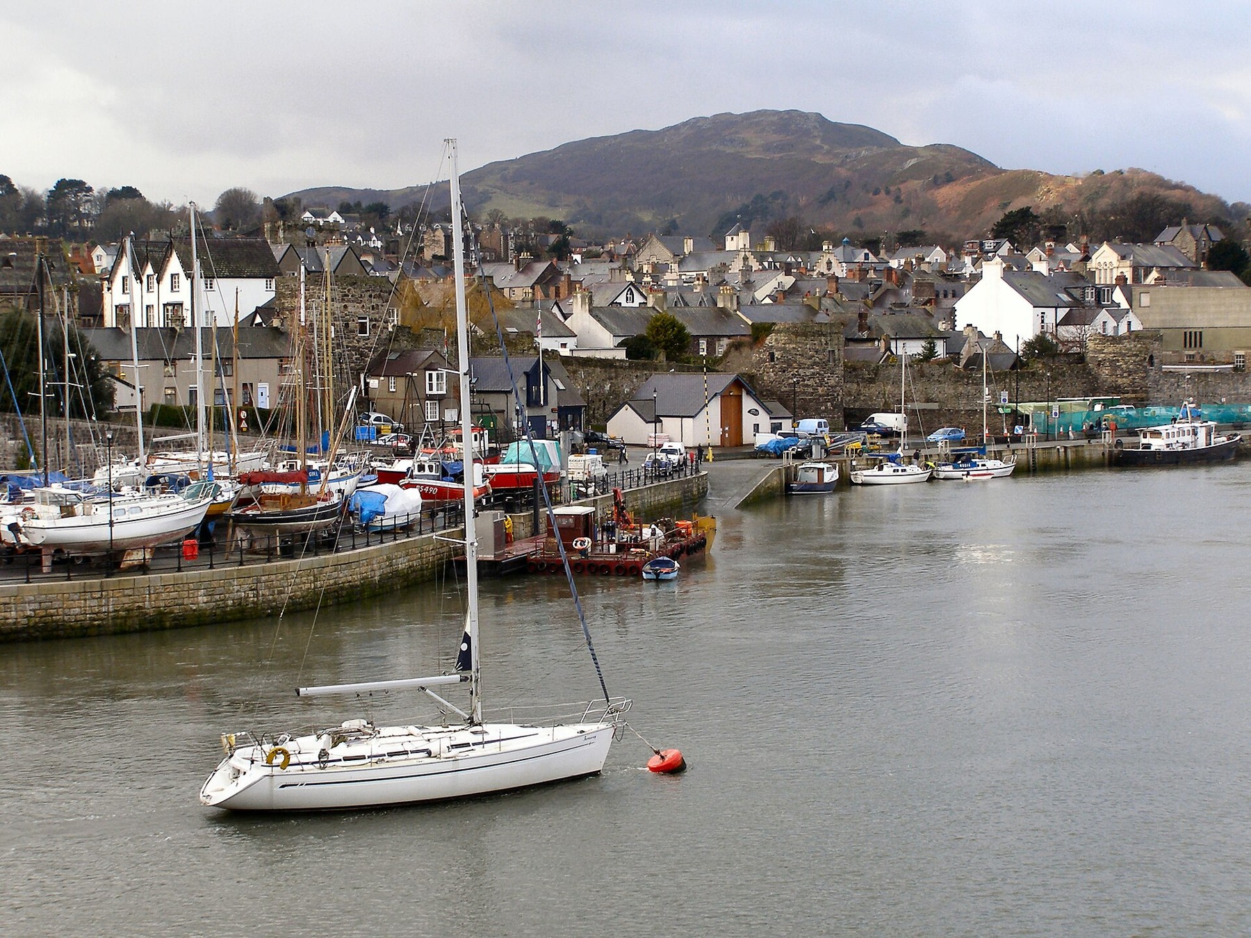 Boats beside Conwy Quay and the waterfront buildings