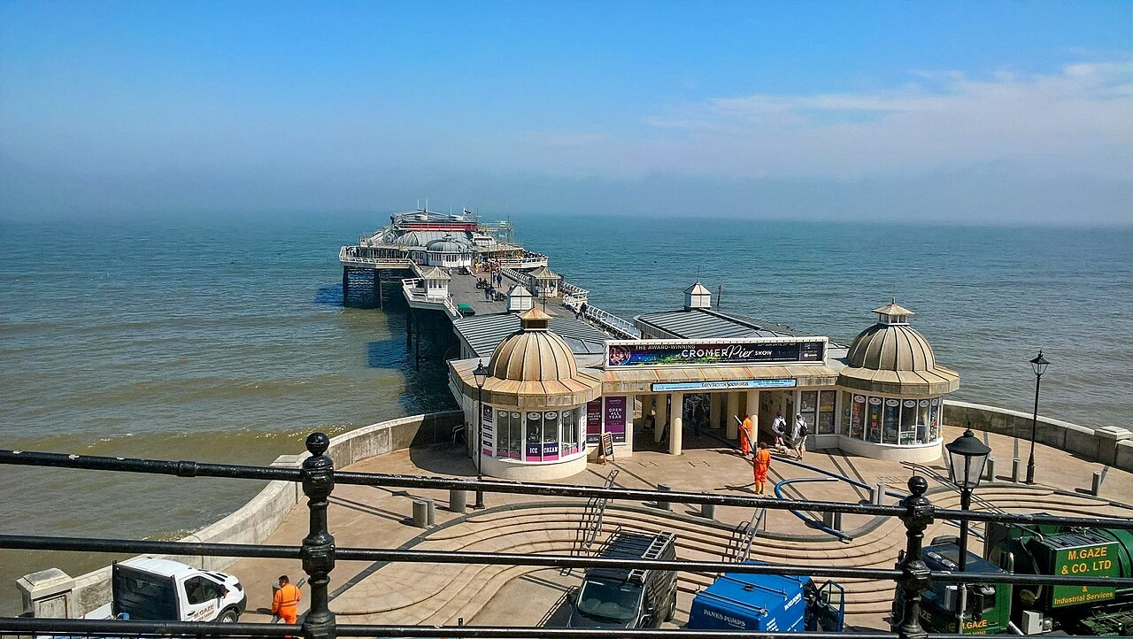 Cromer Pier reaching into the sea beyond its entrance pavilions