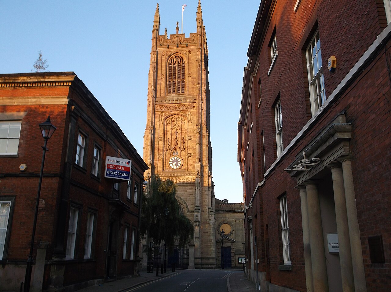 Derby Cathedral tower above the historic buildings on St Mary’s Gate
