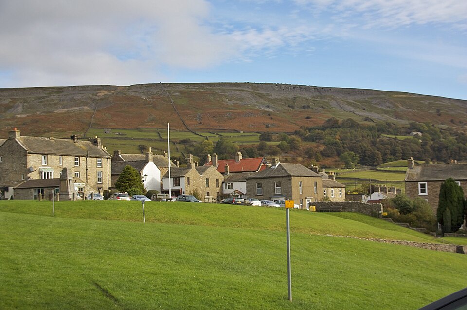 The village green and surrounding buildings in Reeth.