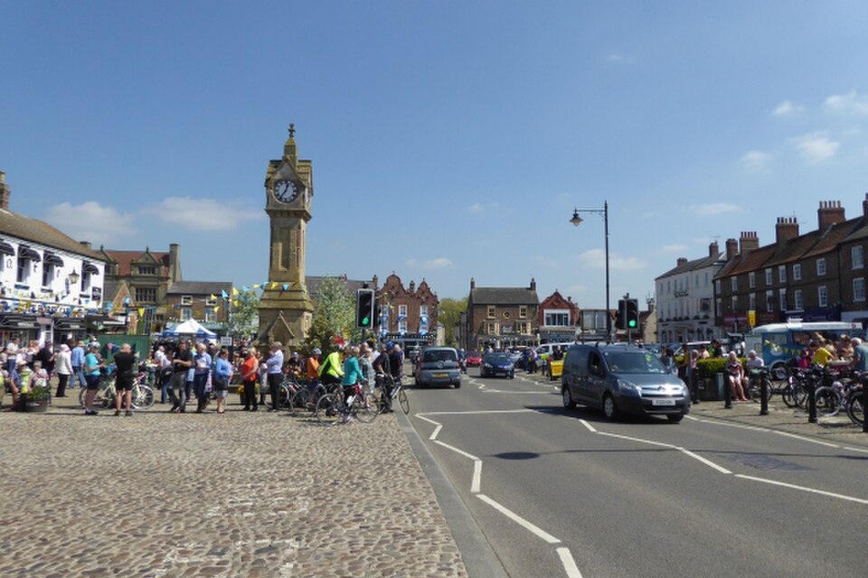 Thirsk Market Place and its surrounding town buildings.