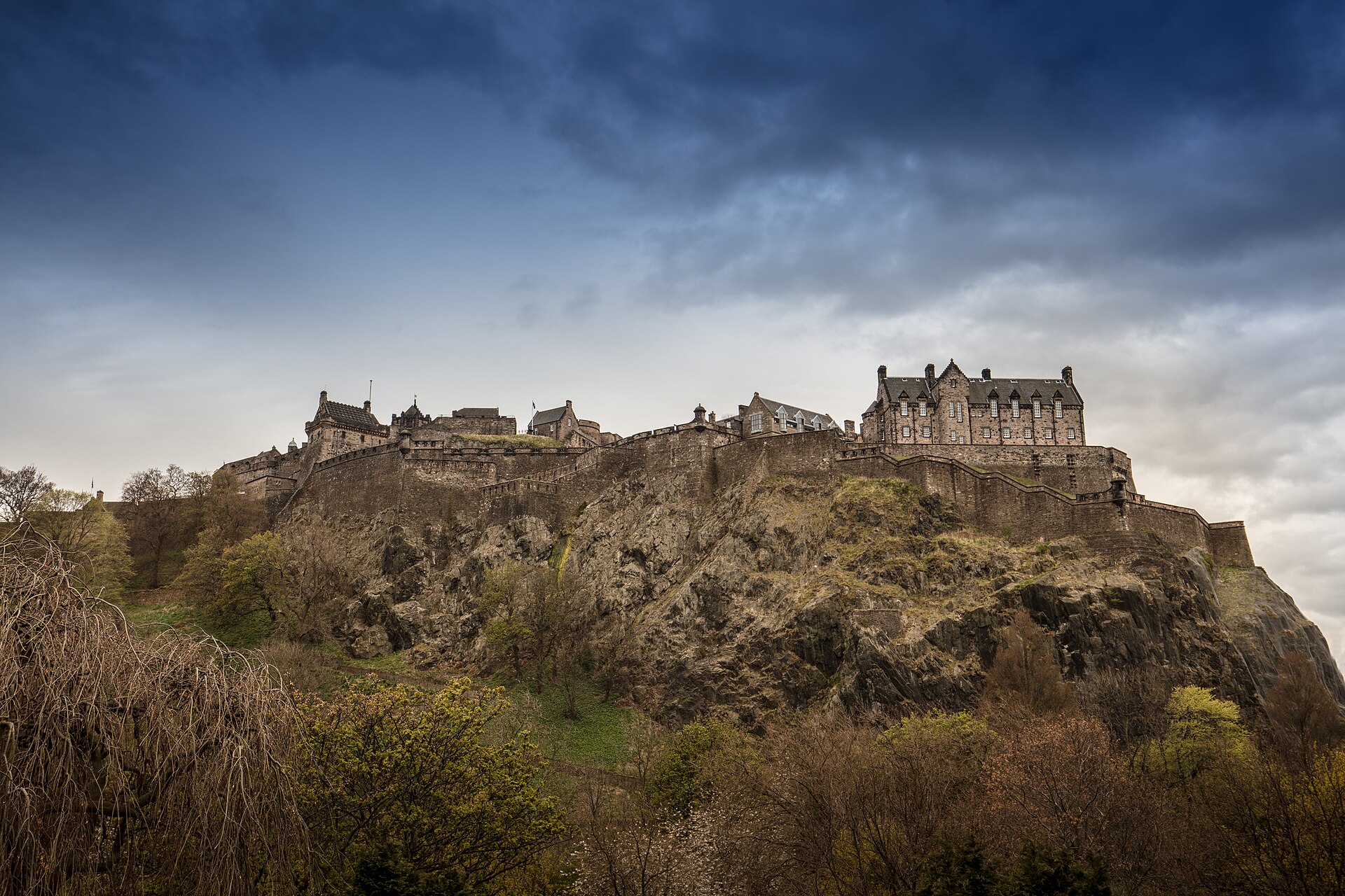 Edinburgh Castle and its stone defences above the rocky hillside