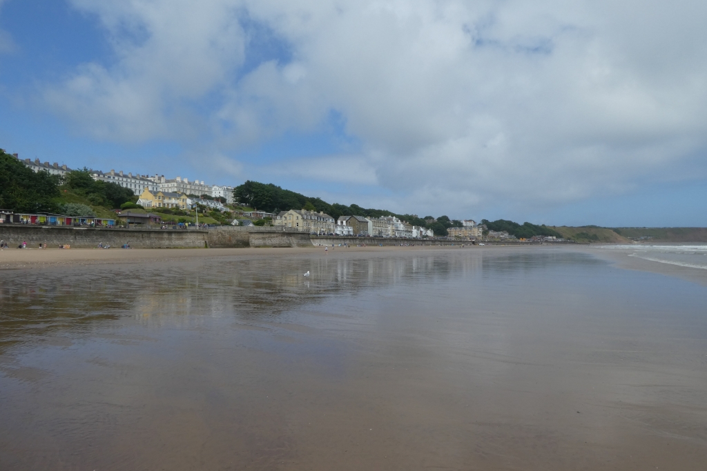 Broad sandy Filey beach beneath the seafront and Crescent buildings