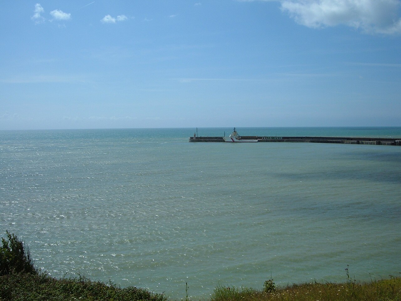 Folkestone Harbour Arm seen across the sea