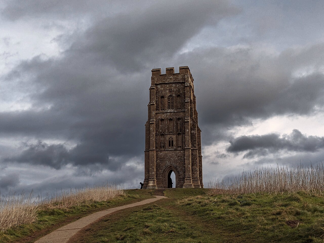 St Michael’s Tower on Glastonbury Tor beneath a cloudy sky