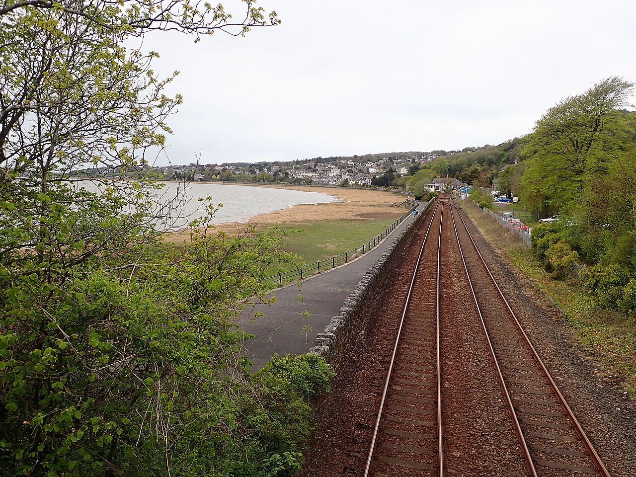 The promenade and railway curving around the shore at Grange-over-Sands