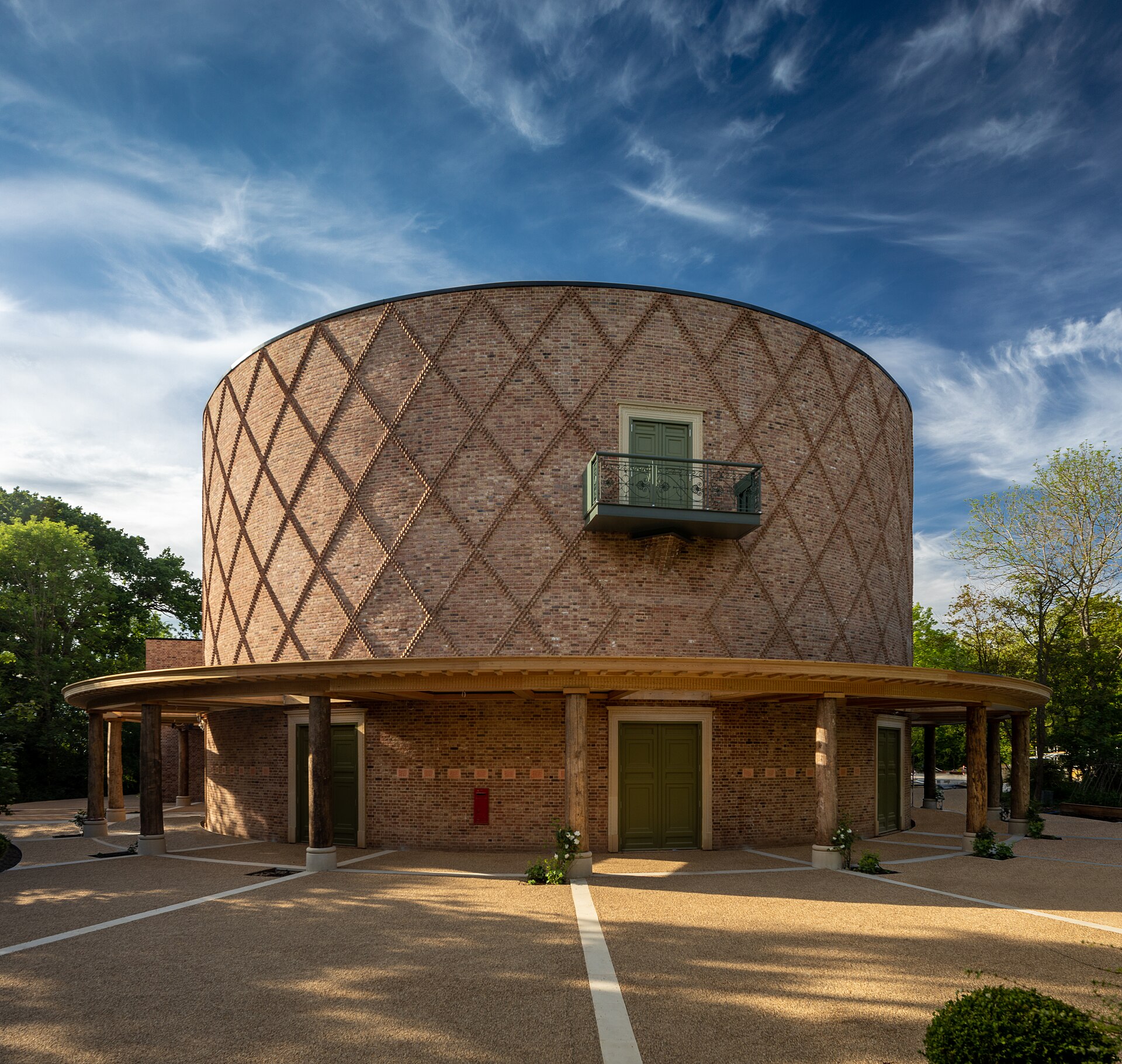 Completed circular brick exterior of the Theatre in the Woods at Grange Park Opera