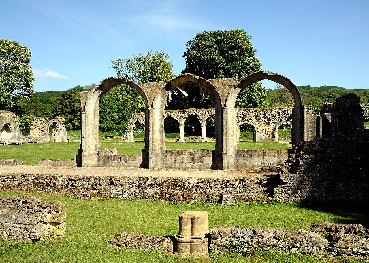 Stone arches and grassed ruins at Hailes Abbey