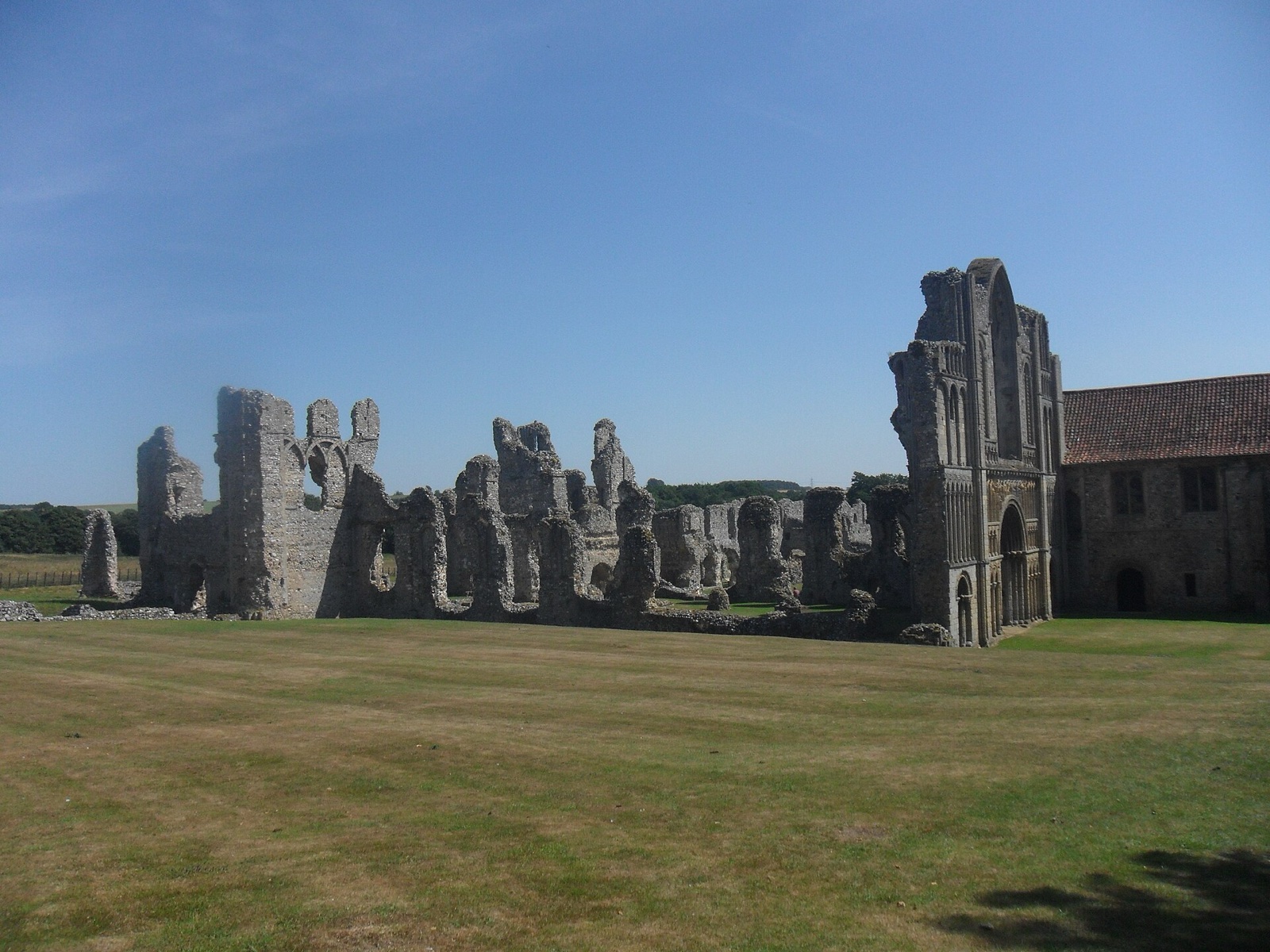 Castle Acre Priory church ruins and surviving west range