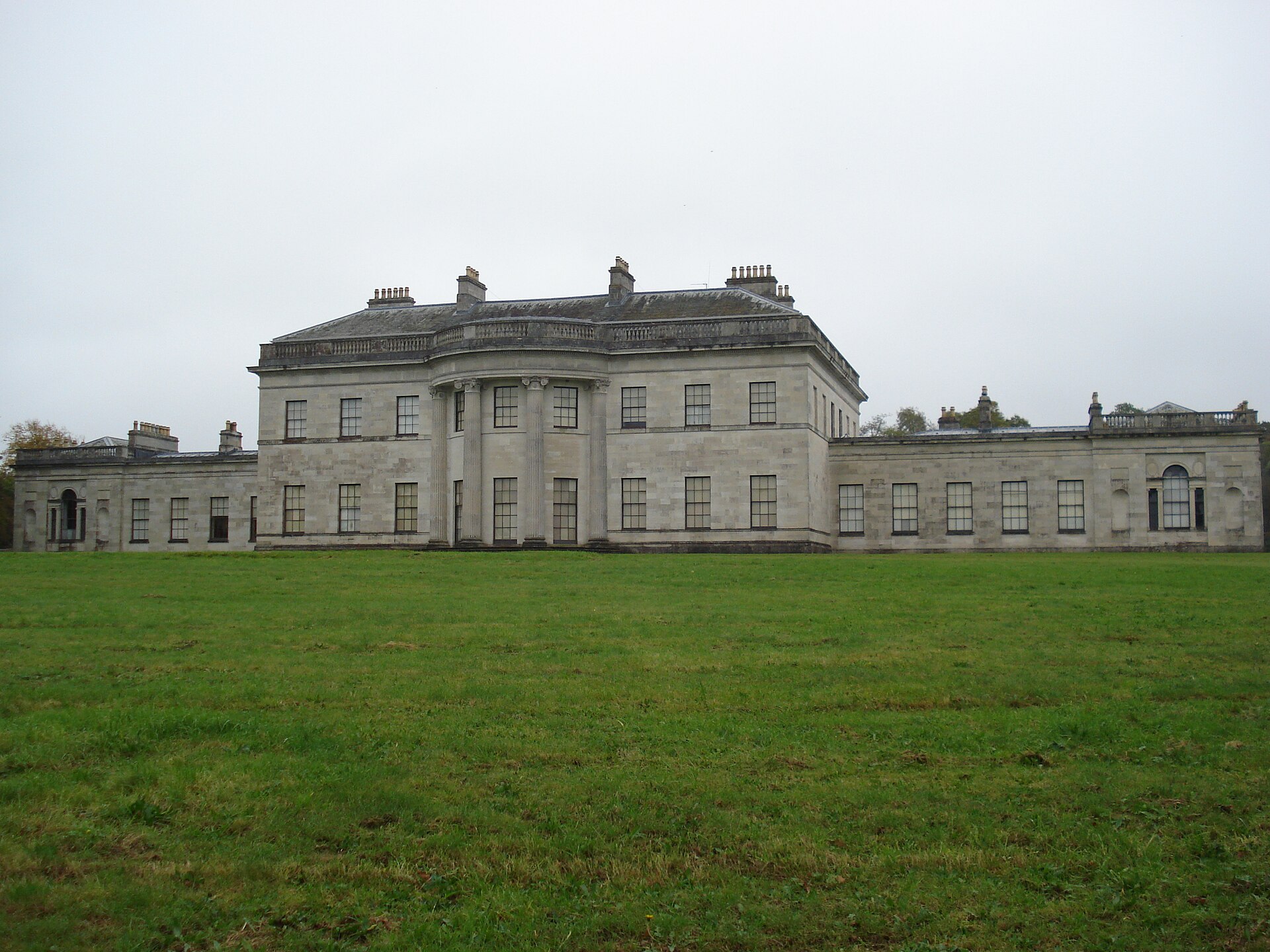 Neo-classical facade of Castle Coole across its lawn in County Fermanagh