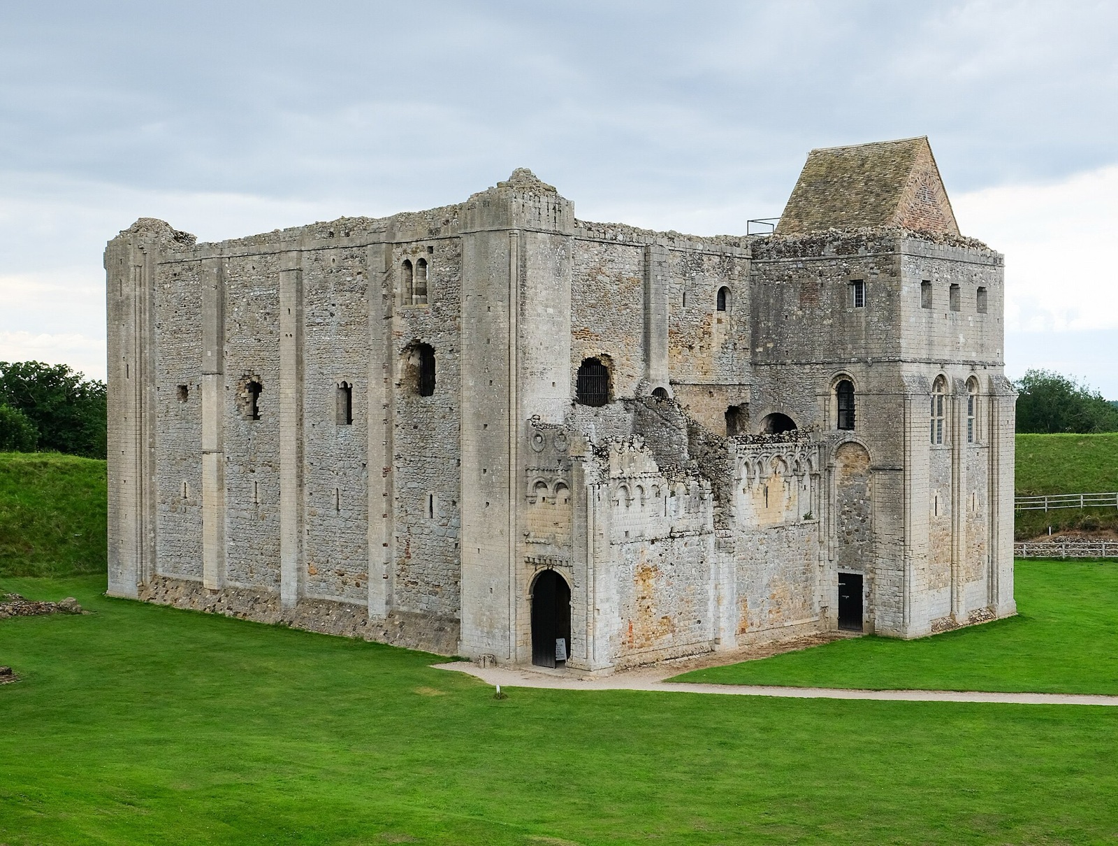 Decorated Norman keep at Castle Rising inside grassy earthworks