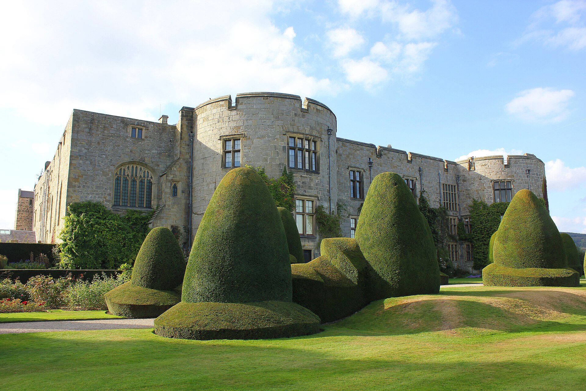 Medieval Chirk Castle above its clipped yew garden in Wales