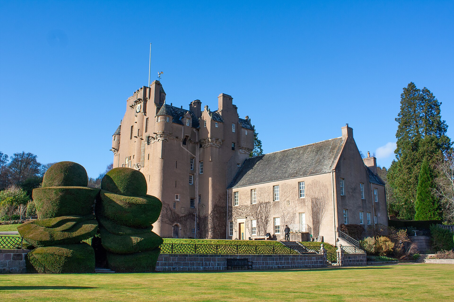 Crathes Castle tower and shaped yews in Aberdeenshire