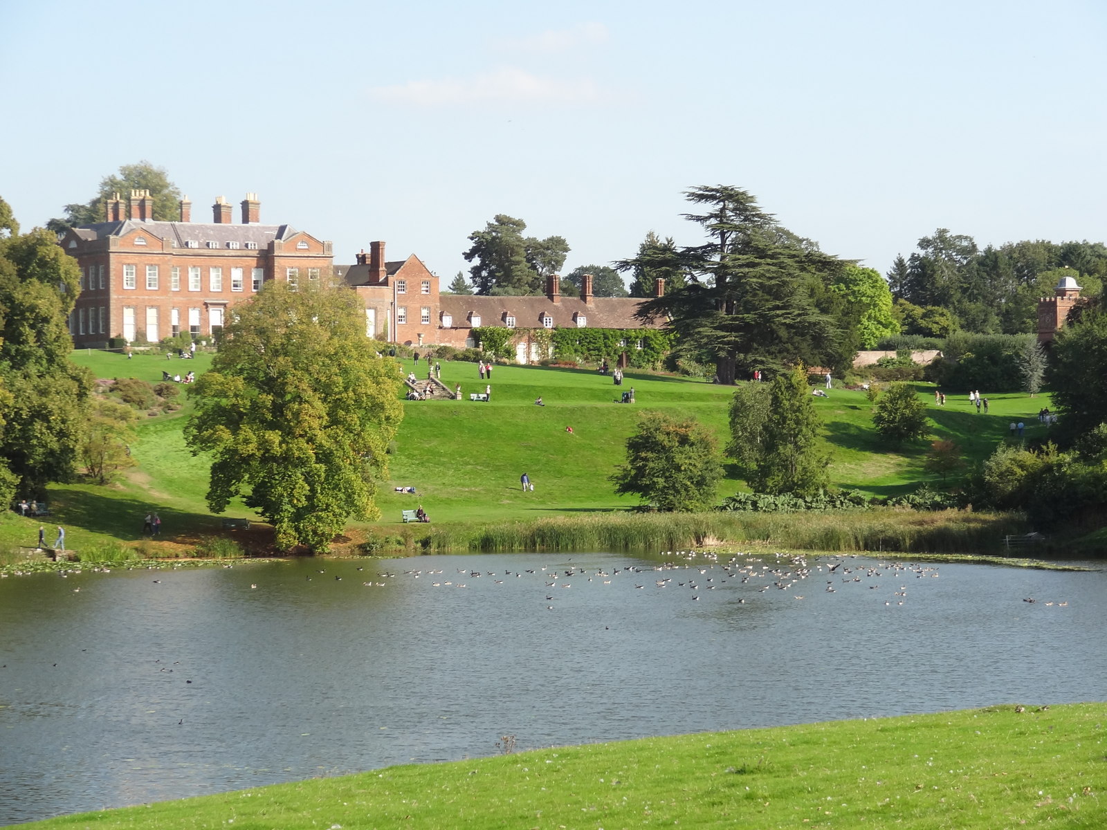 Dudmaston Hall and lawns across the estate lake
