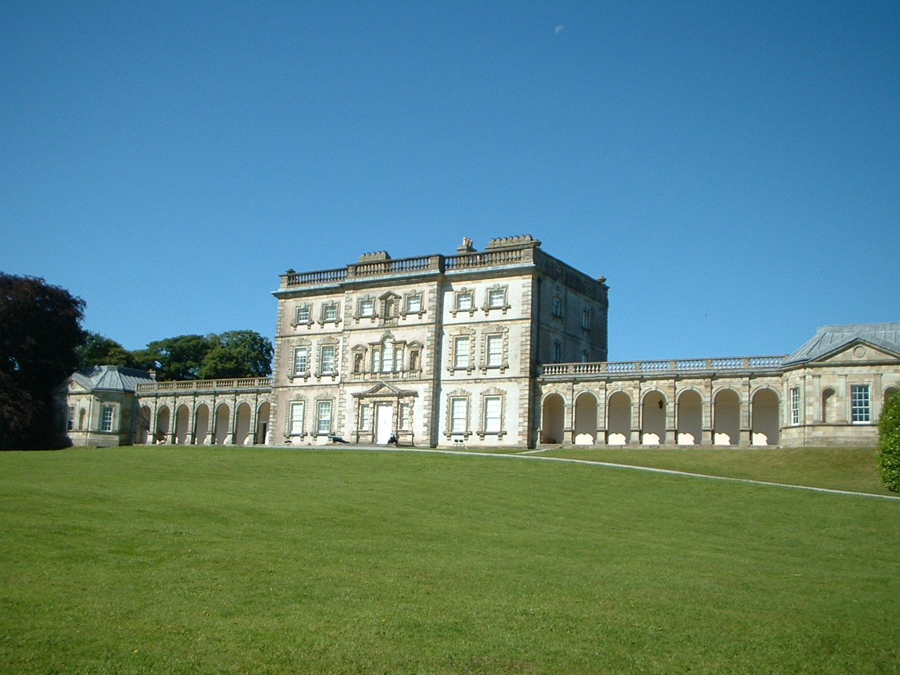 Georgian facade and colonnades of Florence Court against Fermanagh hills