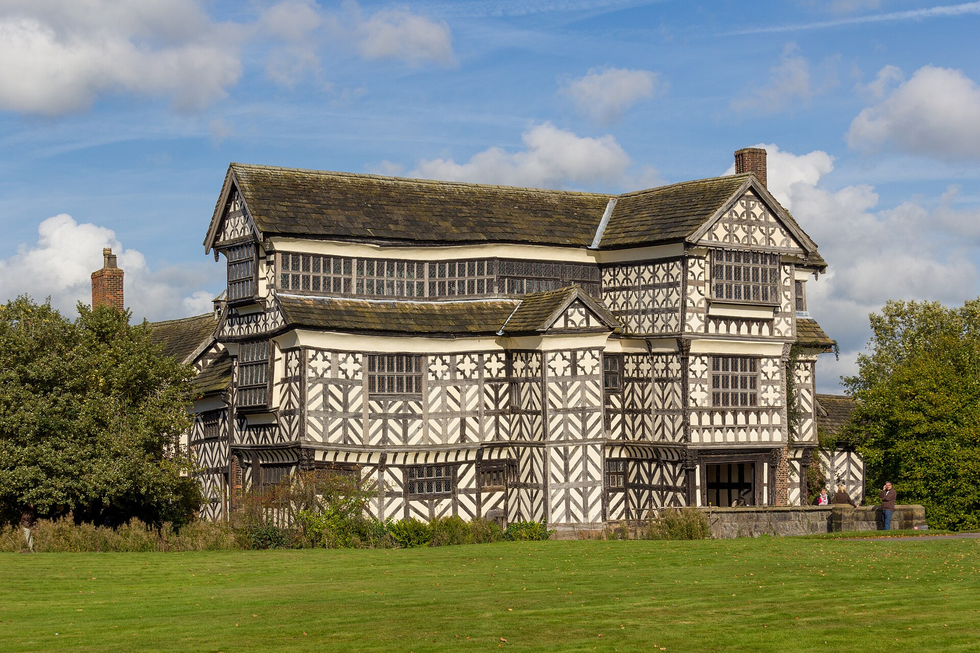 Timber-framed Little Moreton Hall behind its moat