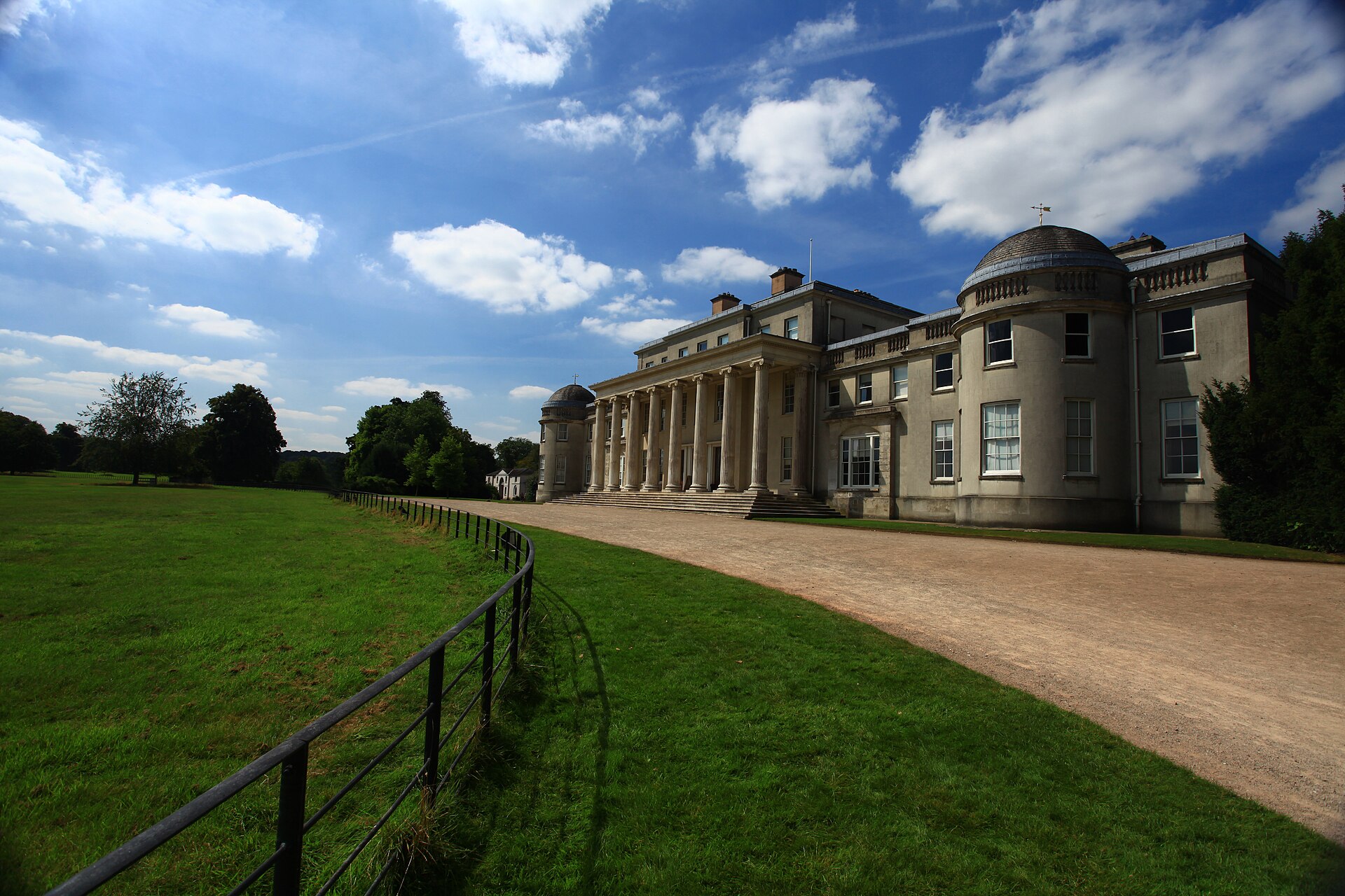 Colonnaded front of Shugborough mansion beside its parkland