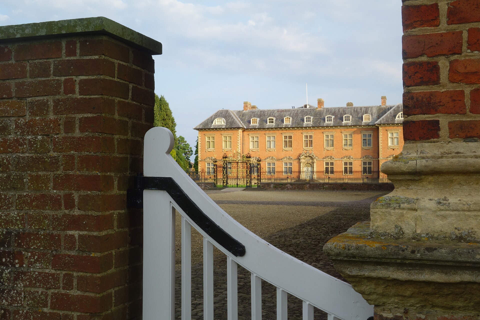 Seventeenth-century brick Tredegar House seen through courtyard gates in Newport