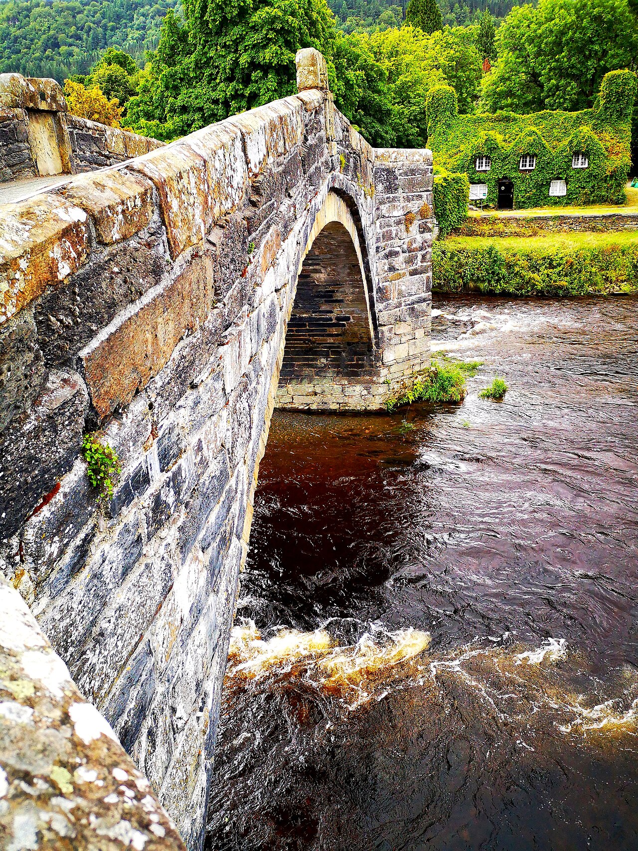 Stone arches of Pont Fawr above the River Conwy at Llanrwst