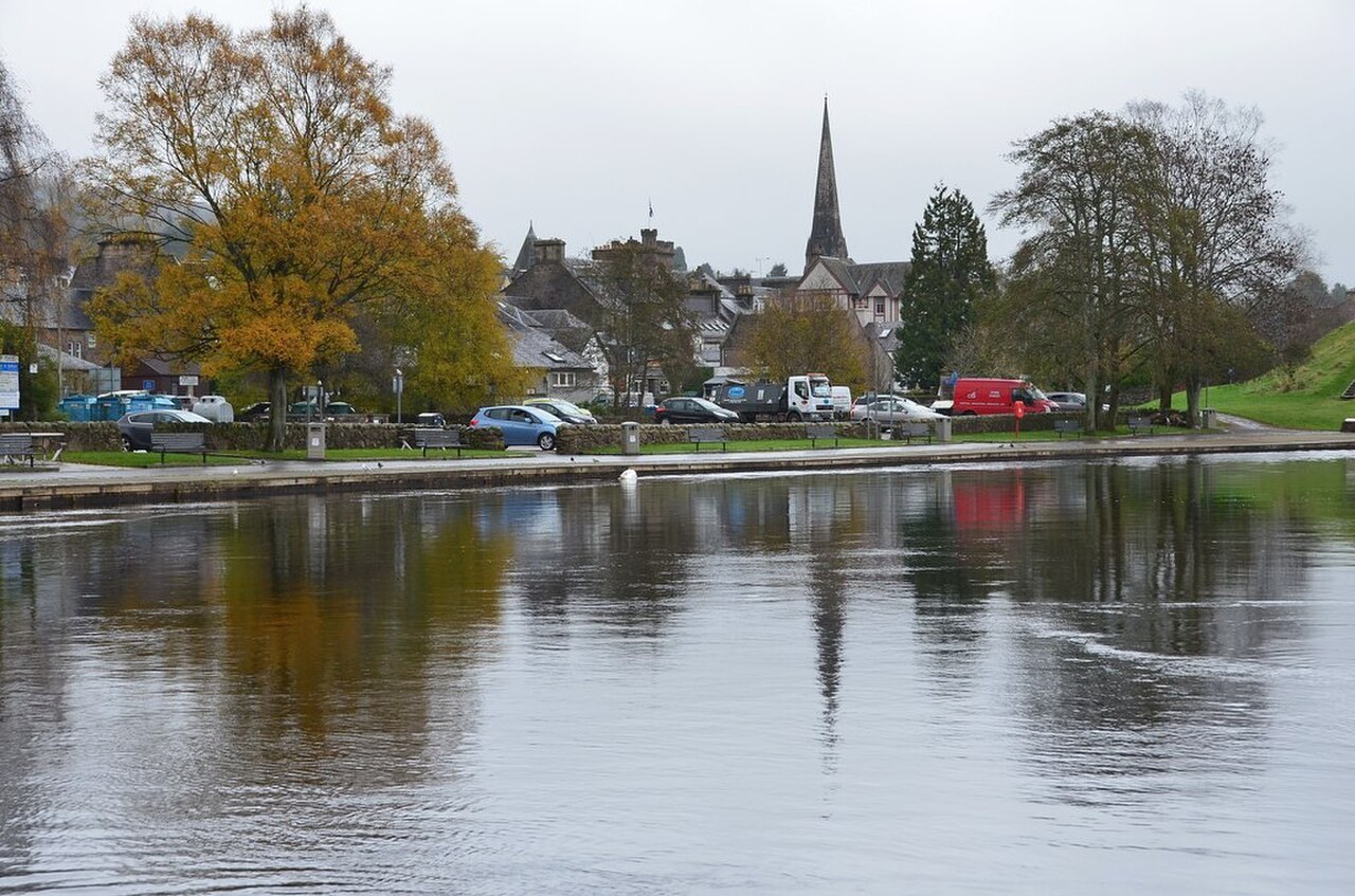 Callander buildings and autumn trees across the River Teith