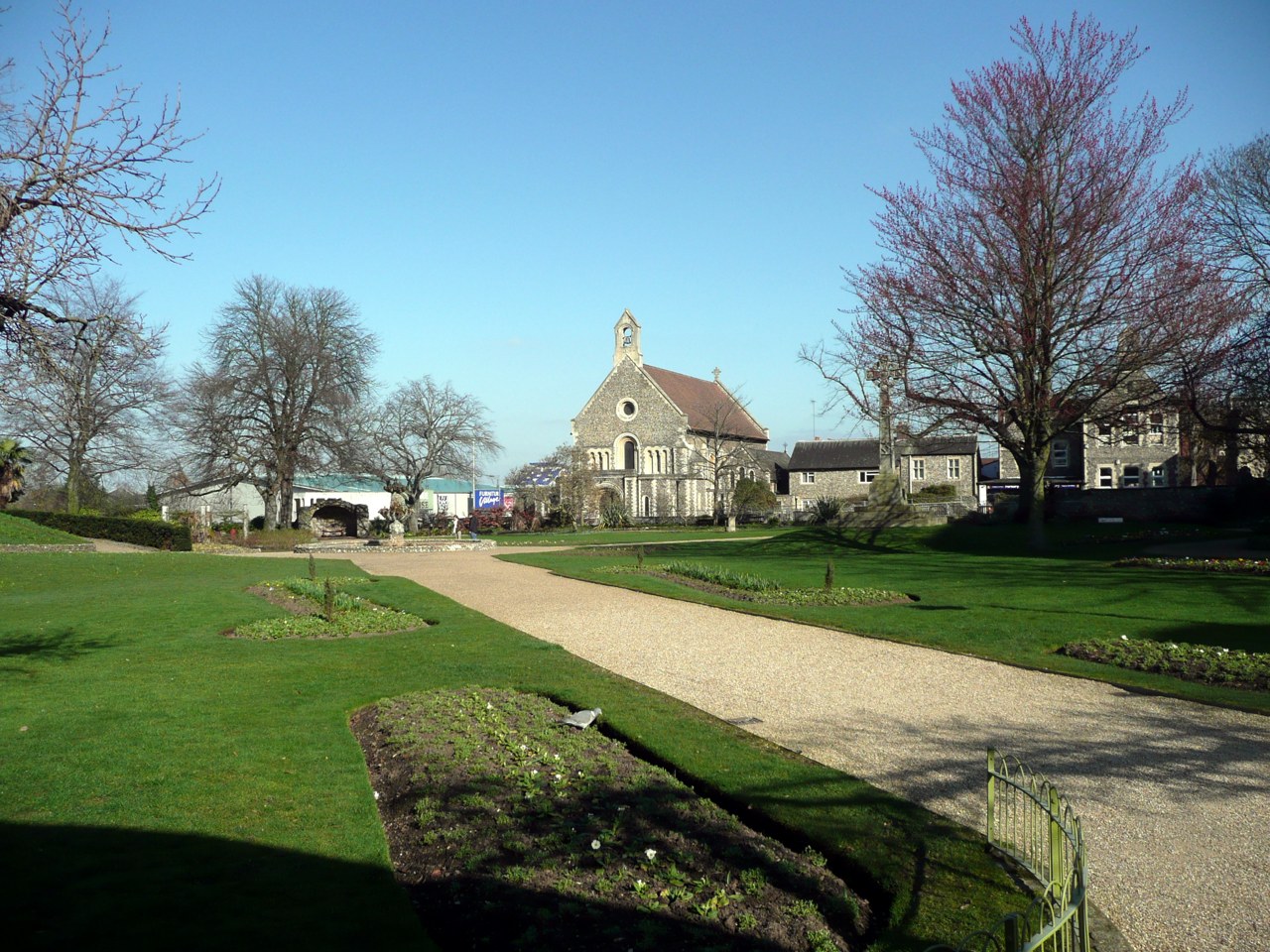 Paths and lawns in Forbury Gardens with St James's Church in Reading
