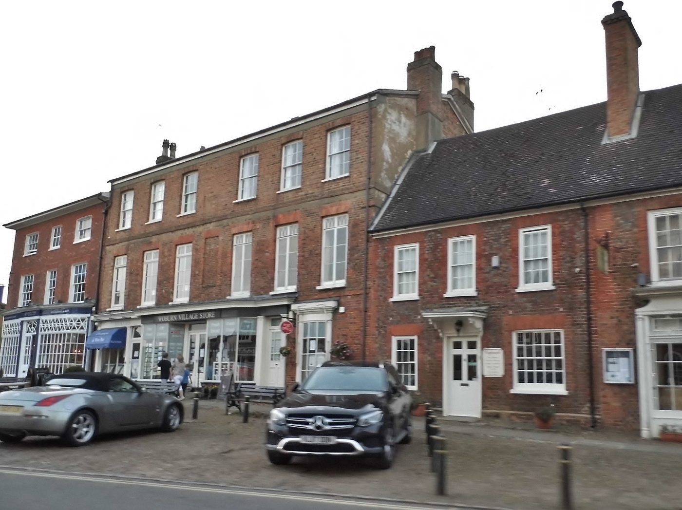 Brick buildings and shops in Woburn village centre, Bedfordshire