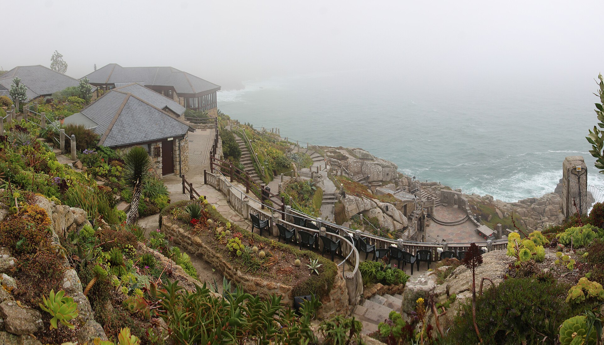 Stone terraces and stage of the Minack Theatre above the sea