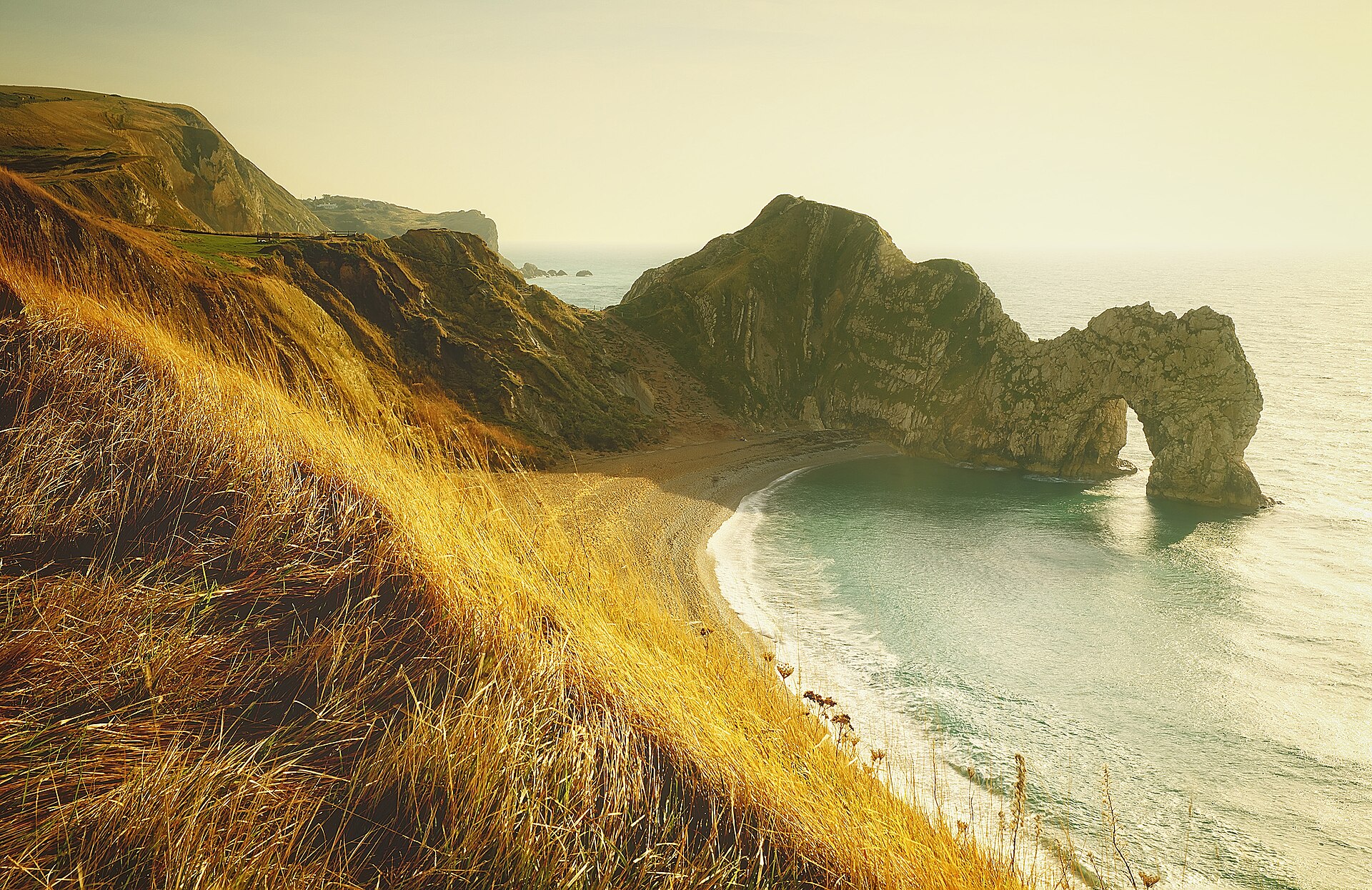 Durdle Door and its beach viewed from the coast path