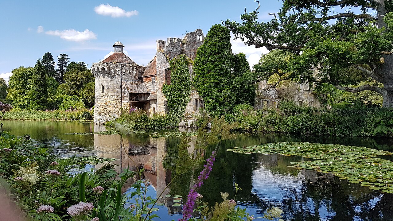 Old Scotney Castle across its garden moat