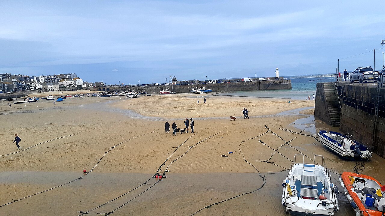 Boats on the sand in St Ives harbour at low tide