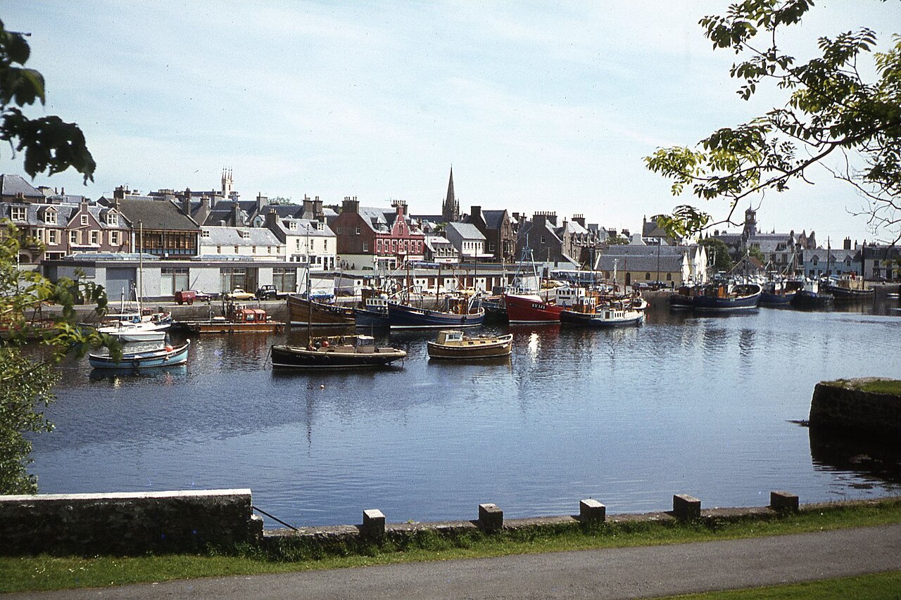 Boats and waterfront buildings across Stornoway Harbour