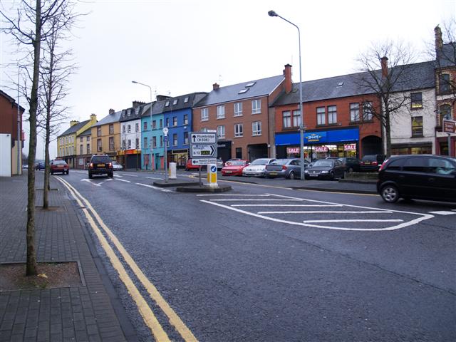 Colourful shopfronts along a street in Strabane town