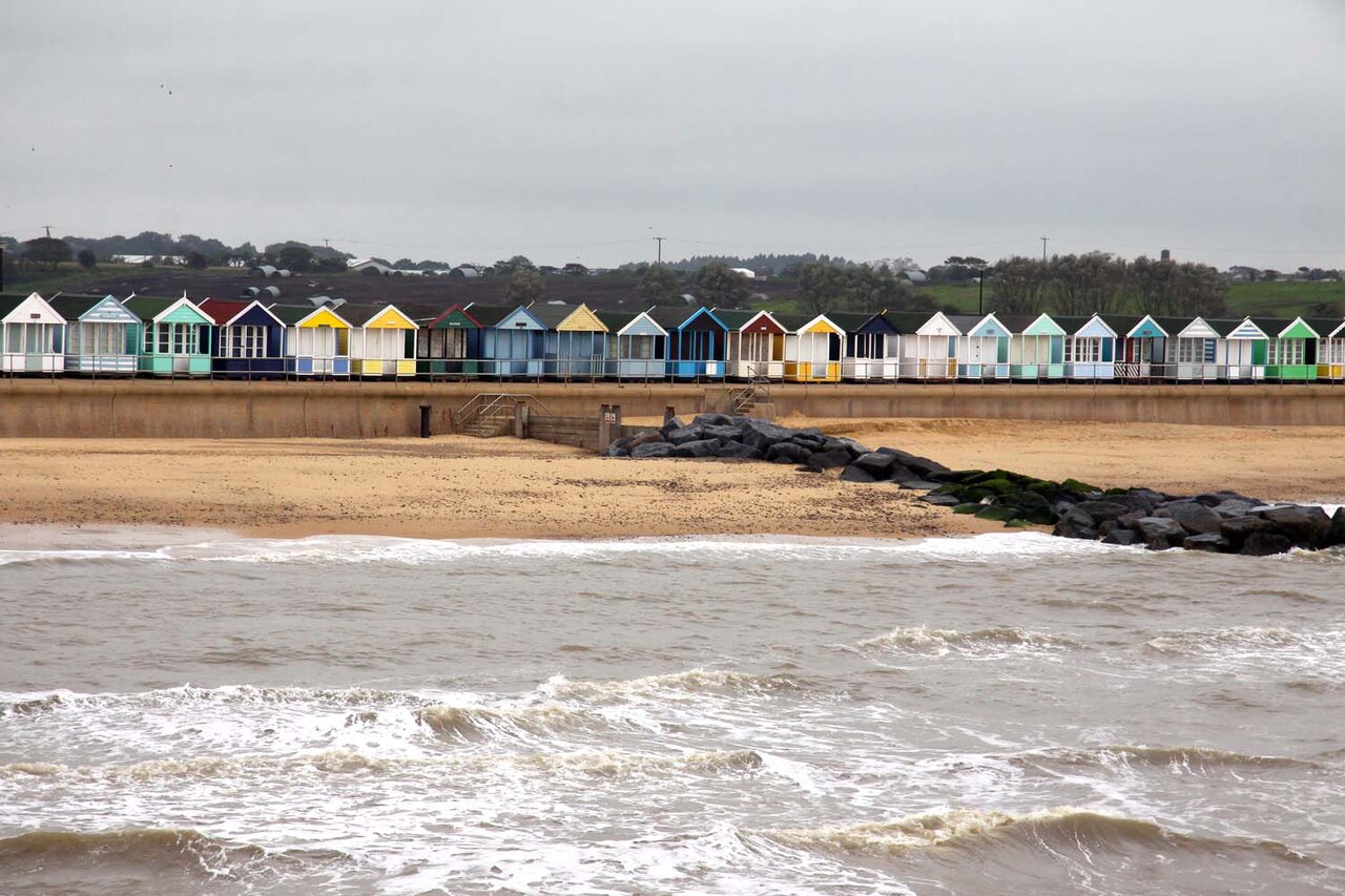 Beach huts and waves at Southwold, Suffolk