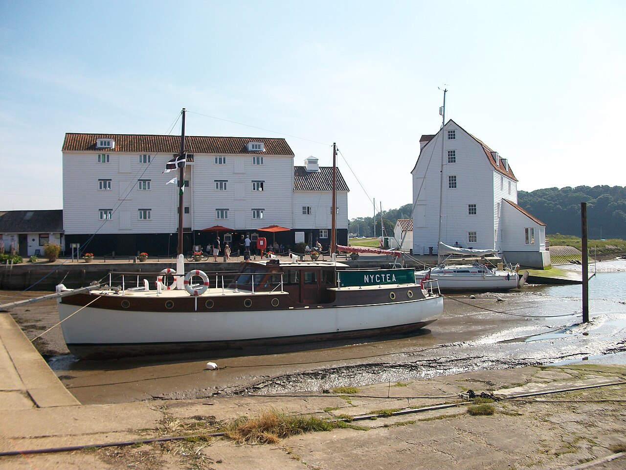Boats beside Woodbridge Tide Mill at low water
