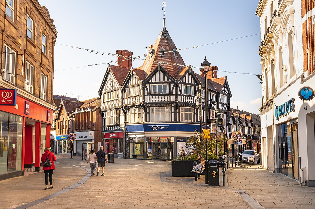 Pedestrian streets and a timber-framed corner building in Wrexham city centre